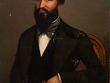 un tableau représentant un homme barbu assis sur une chaise