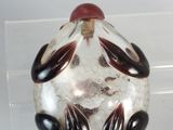 a glass ball with black and white designs on it