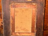 a picture of an old picture frame on the floor