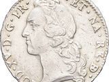a close up of a coin with a woman ' s head on it