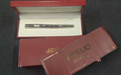 a pen that is in a red box on a table