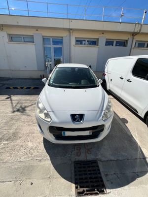 two cars parked next to each other in front of a building