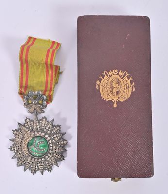 two medals and a book sitting on a table