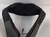 the back of a black fanny bag with a zipper on it