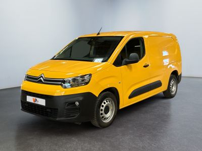 a yellow van parked in a room with a black floor