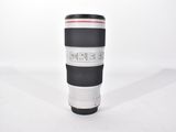 a large camera lens sitting on top of a coffee cup