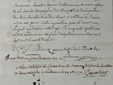 an old document with writing on it sitting on top of a table