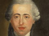 portrait of a man in a blue coat and white collared shirt