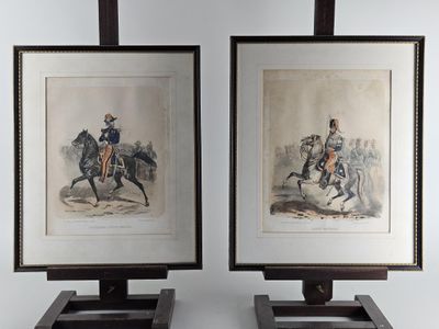 two framed prints of a man riding a horse and a woman riding a horse