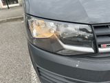 a close up of a car ' s headlight on a parking lot