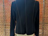 the back of a black jacket on a mannequin mannequin mannequin mannequin mann