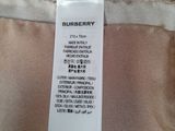 the label on the back of a burberry dress is clearly visible