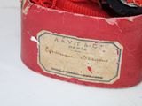 a red box with a black tie and a red and white tie