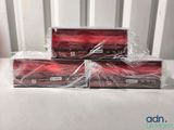 two boxes of red soap sitting on top of a white table