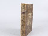 an old book that is sitting on top of a table