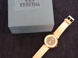 an image of a watch sitting on top of a table next to a box