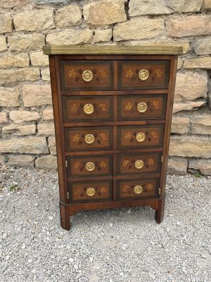 a picture of a wooden wall mounted with many drawers