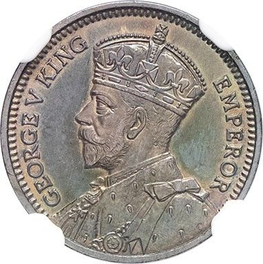 a silver coin with a crown on top of it