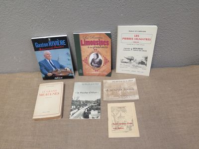 several books are sitting on a table next to each other