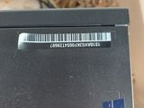 a black box with a barcode on it sitting on a table