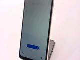 a phone that is sitting on top of a stand