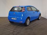 a small blue car that is parked in a room