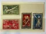 four different stamps are on a piece of paper on a white surface