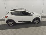 a white car parked in a garage with a roof rack