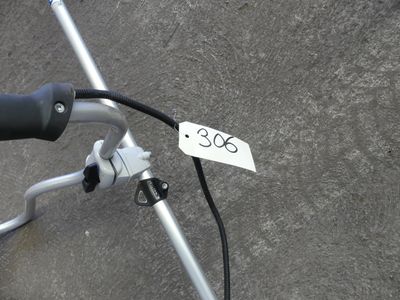a close up of a bicycle handlebar with a price tag on it