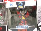 two batman action figures in the box on the table