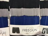 several pairs of men ' s socks are on display in a store
