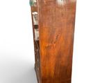 an image of a tall wooden cabinet with a glass door