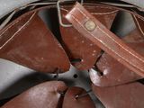 a brown leather case with a fan inside of it