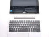 a laptop and a tablet on a white table