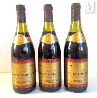 three bottles of wine sitting on top of a table next to each other