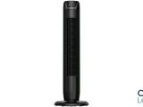 a black tower fan sitting on top of a white table