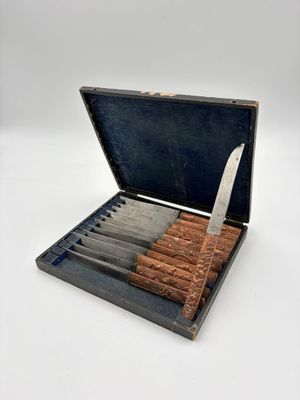 a box with a set of knives inside of it