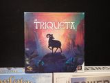 three board games sitting on a table next to each other