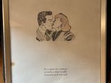 a drawing of a man kissing a woman on the forehead