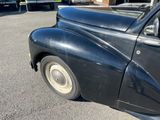 a black car that is parked in a parking lot