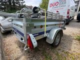 a trailer with a trailer attached to the back of it