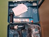 a blue case with tools inside of it on a table
