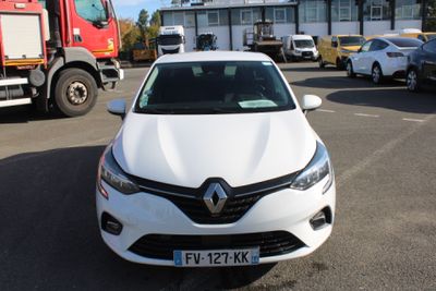 a white car that is parked in a parking lot