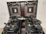 two open suitcases with wires in them on a table