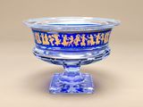 a glass bowl with a blue and gold design on it