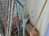 a lot of tools that are sitting outside of a house