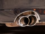 a close up of a car exhaust pipe on the back of a car