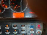 a close up of a car dashboard with a lot of buttons on it