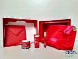 the contents of a red gift box with a red bag and a red bag