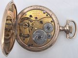 an image of a gold pocket watch with a chain attached to it